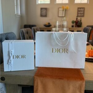 Dior White paper bag. (Bag only) 
Size: Medium to large
Fits a medium box.